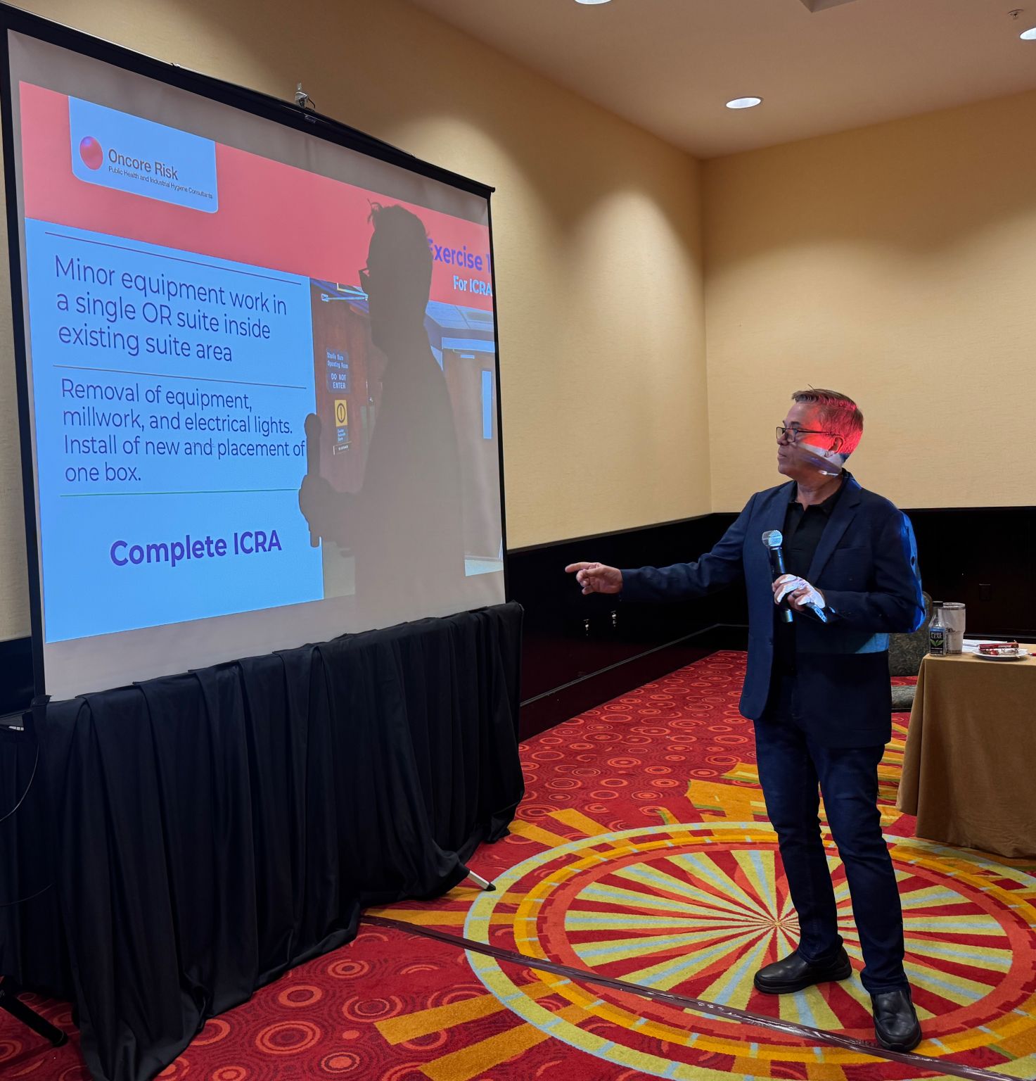 Robert Booth presenting an ICRA exercise slide during a training session