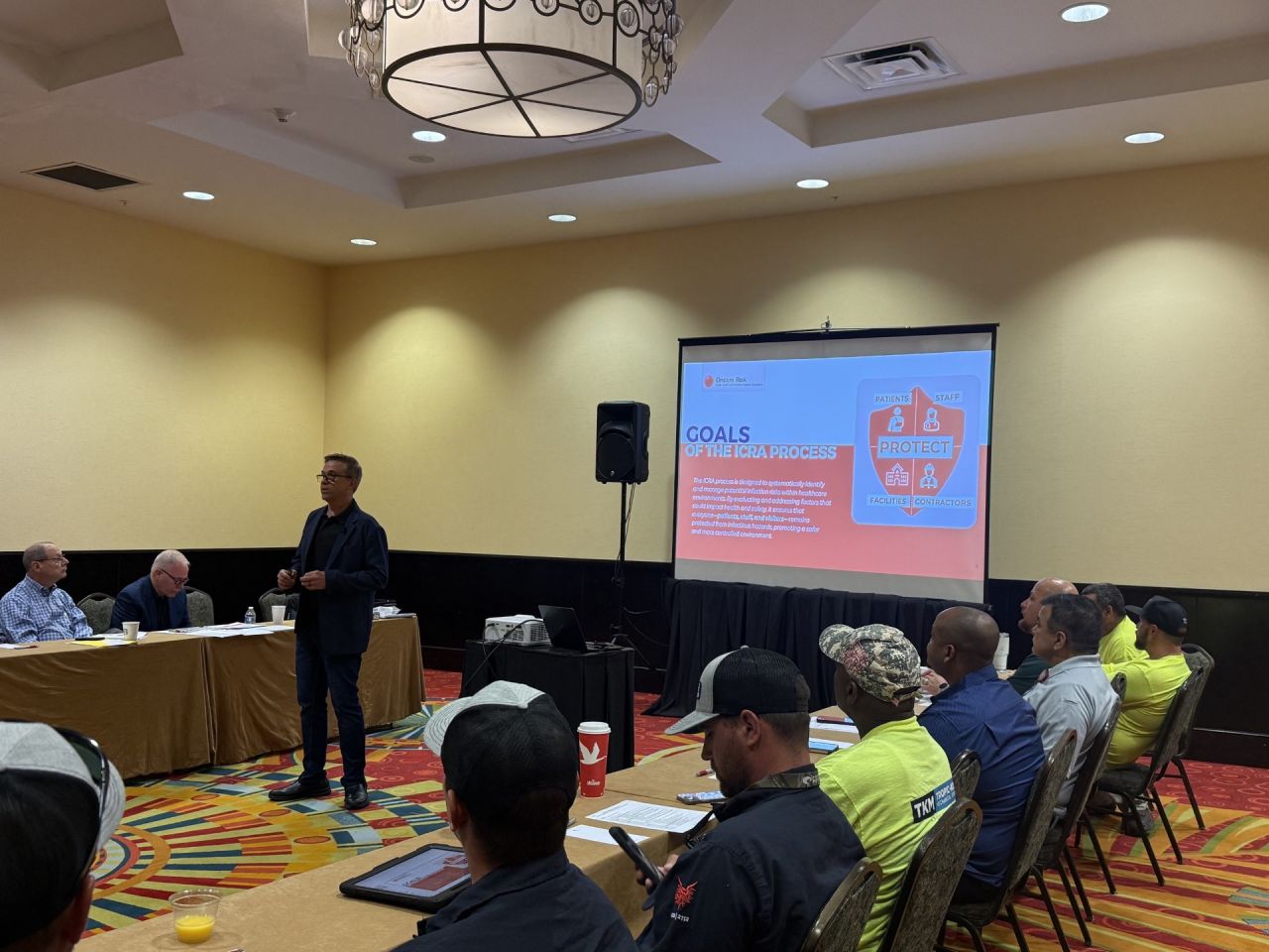 Robert Booth teaching an ICRA class to a room of contractors and trade workers